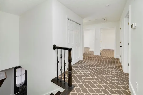 a bathroom with a shower and a glass door
