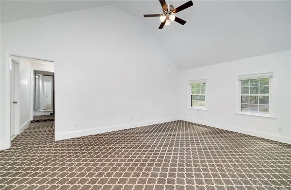 wooden bathroom with a shower