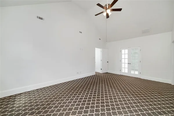 a bathroom with a sink shower and a mirror