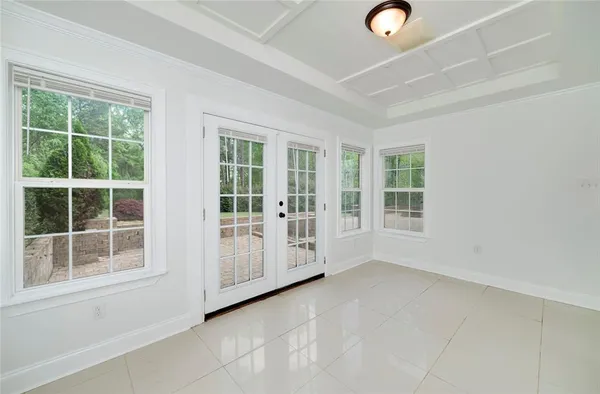 a kitchen with stainless steel appliances granite countertop a stove a refrigerator a sink dishwasher a dining table and chairs with wooden floor