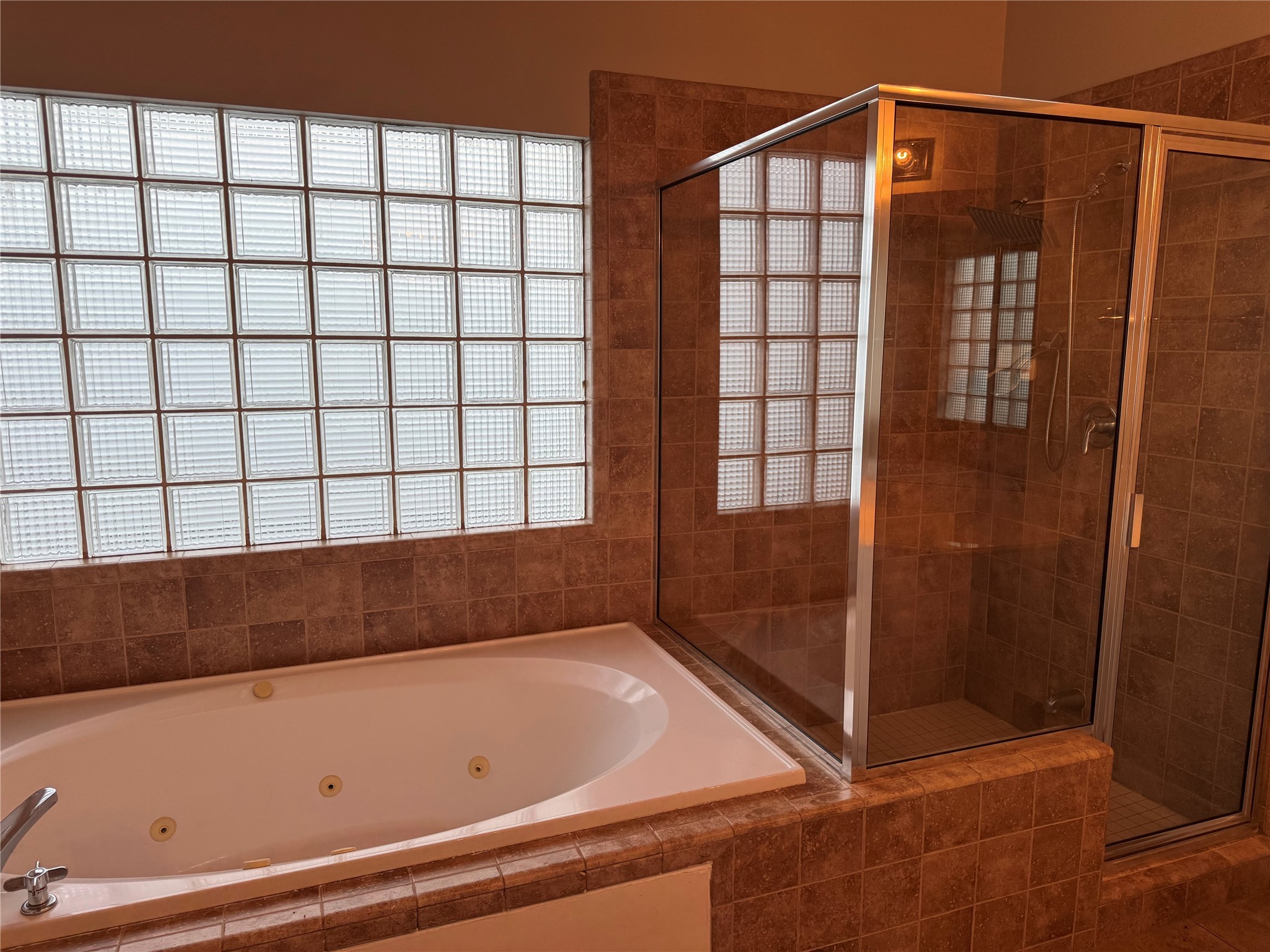 3606 Omeara Drive Houston, TX 77025 - Photo 12 of 21 a bathroom with a bathtub and shower