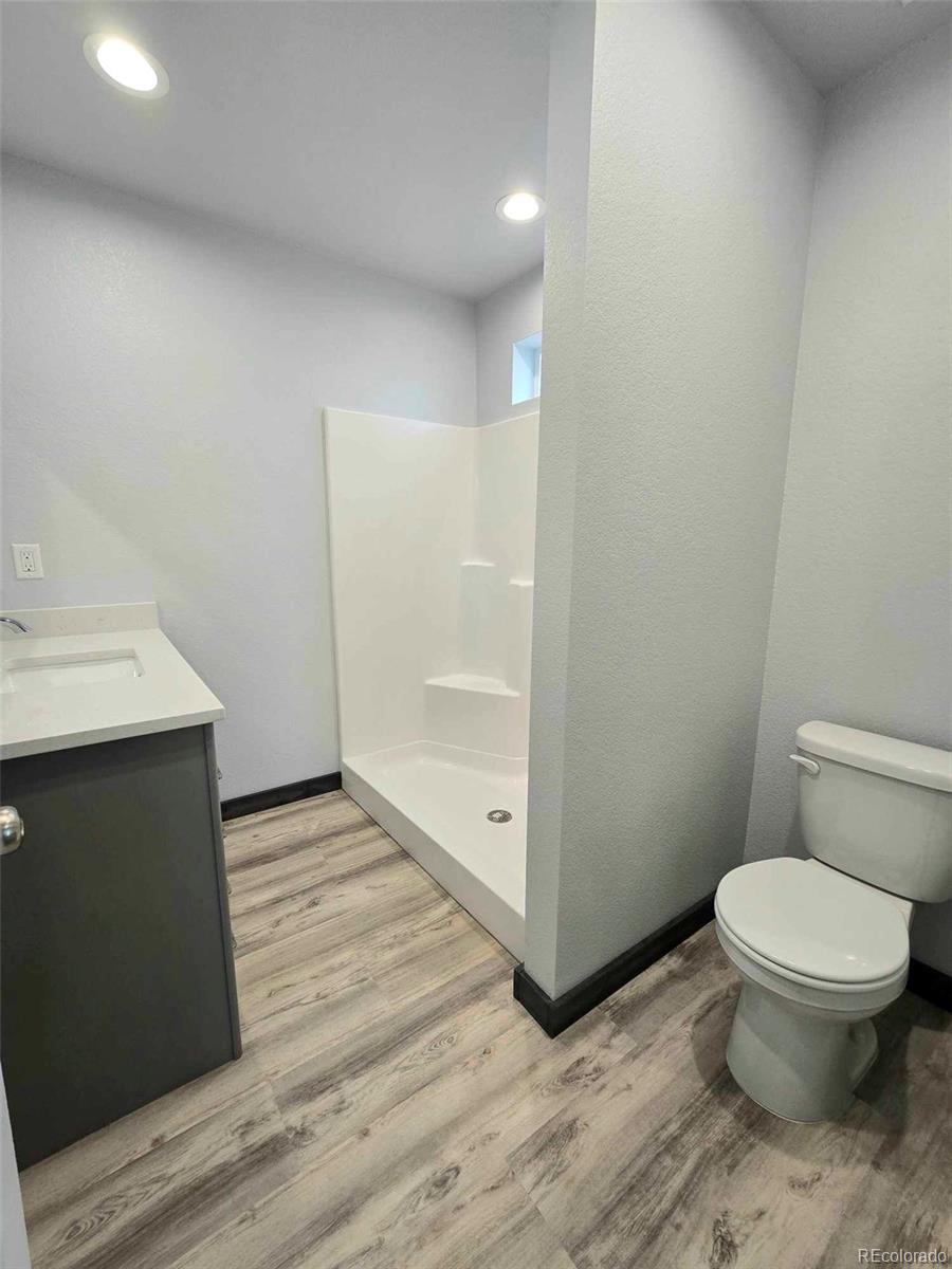 121 Quincy Street Florence, CO 81226 - Photo 13 of 23 a bathroom with a sink and a toilet