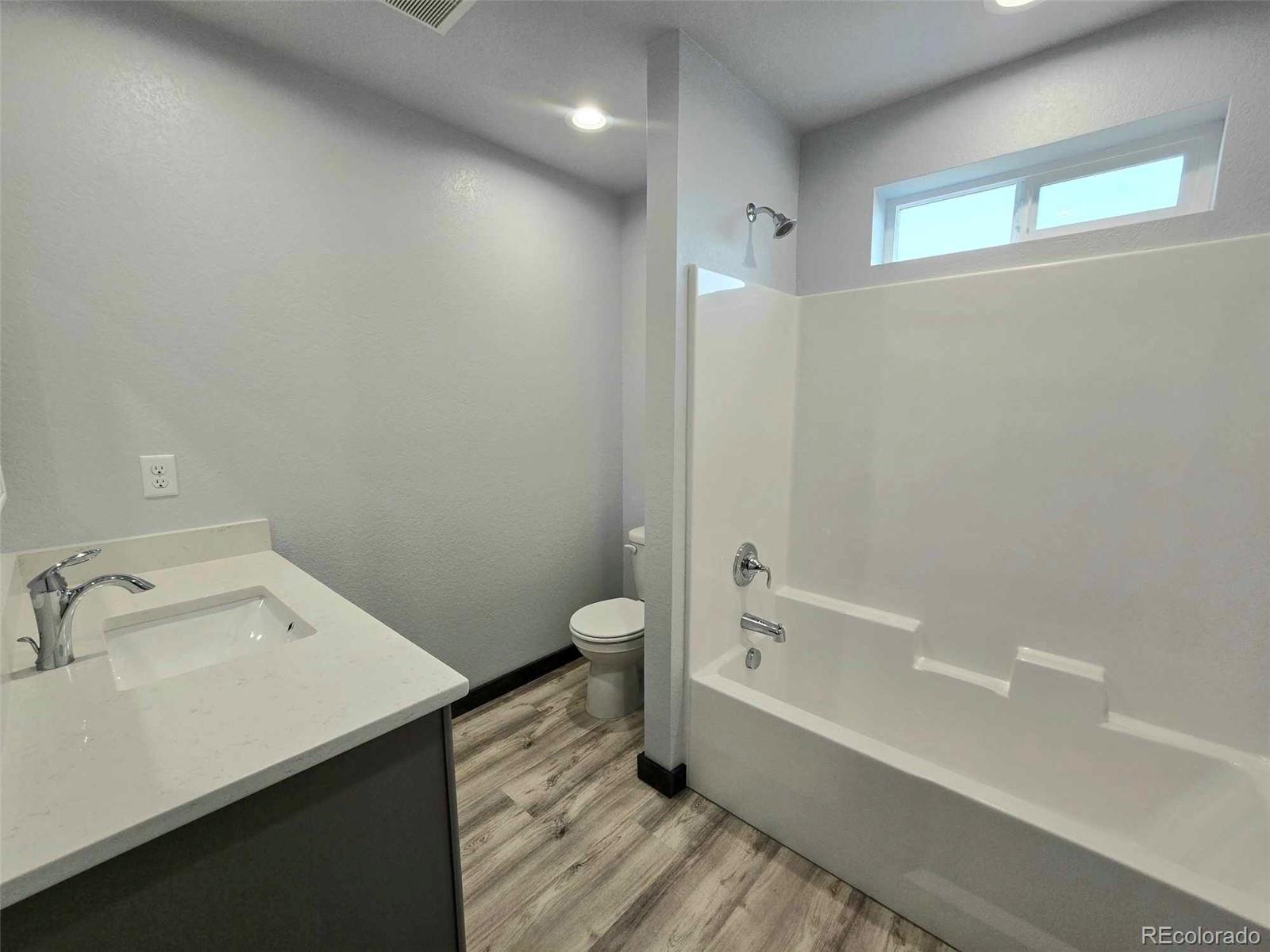 121 Quincy Street Florence, CO 81226 - Photo 17 of 23 a bathroom with a sink a toilet and shower