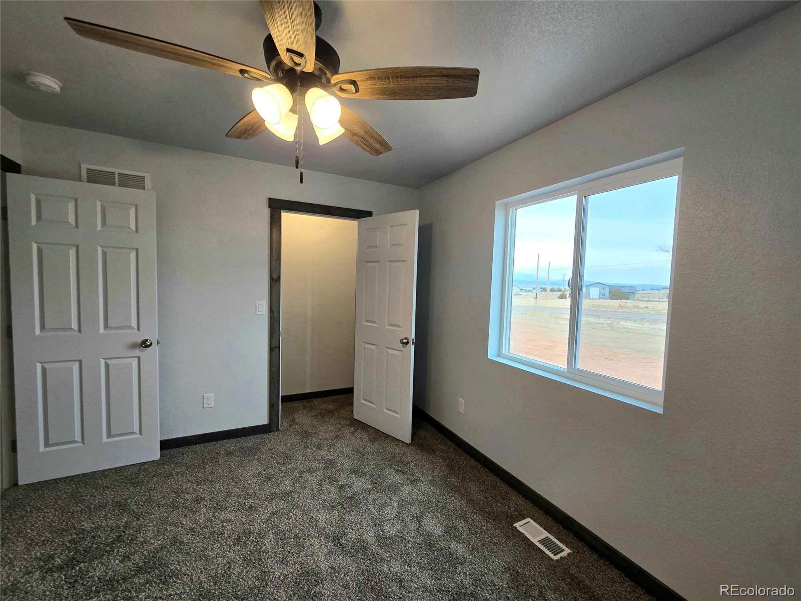 121 Quincy Street Florence, CO 81226 - Photo 20 of 23 a view of an empty room with a window