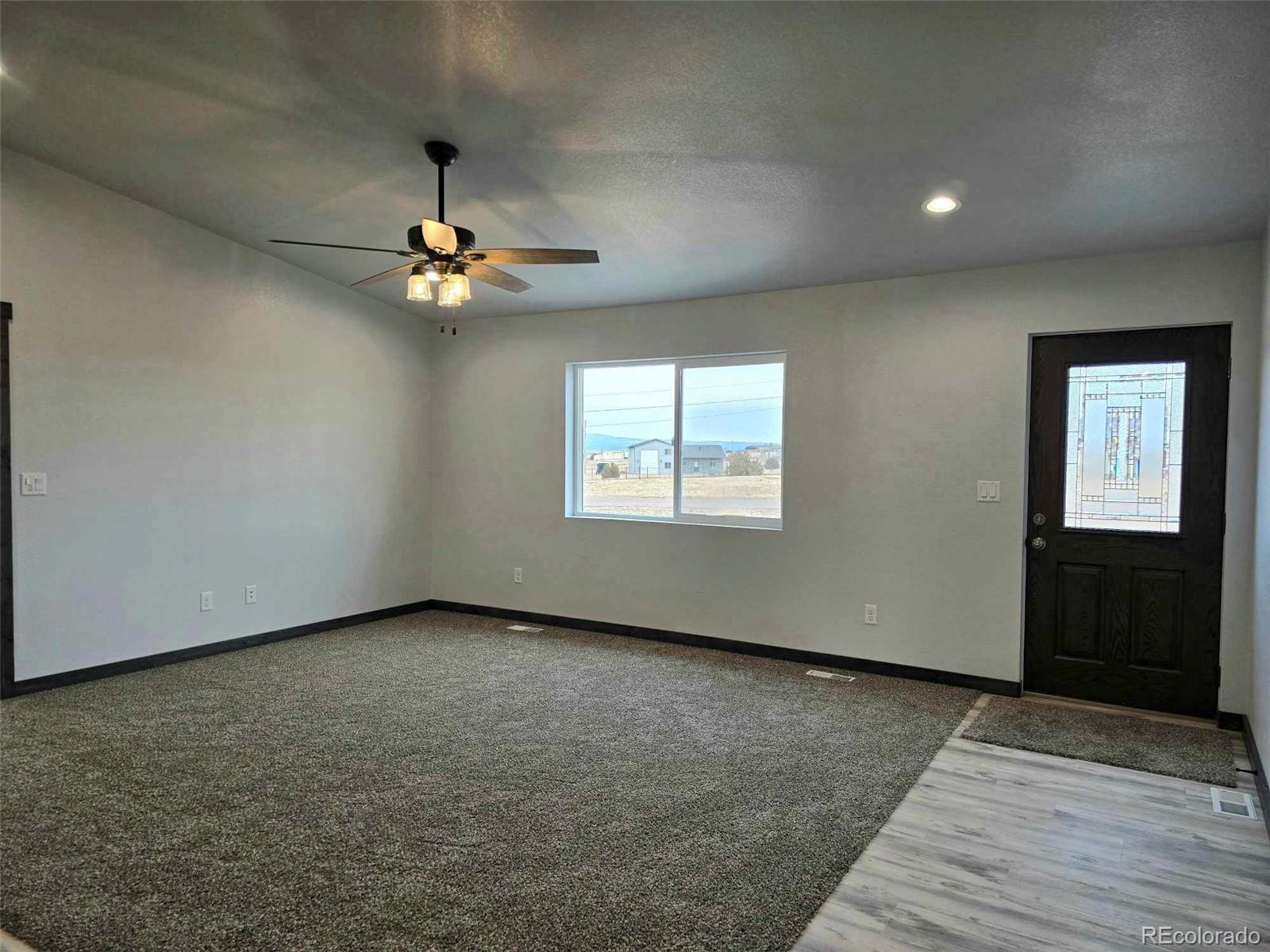 121 Quincy Street Florence, CO 81226 - Photo 21 of 23 an empty room with fan and windows