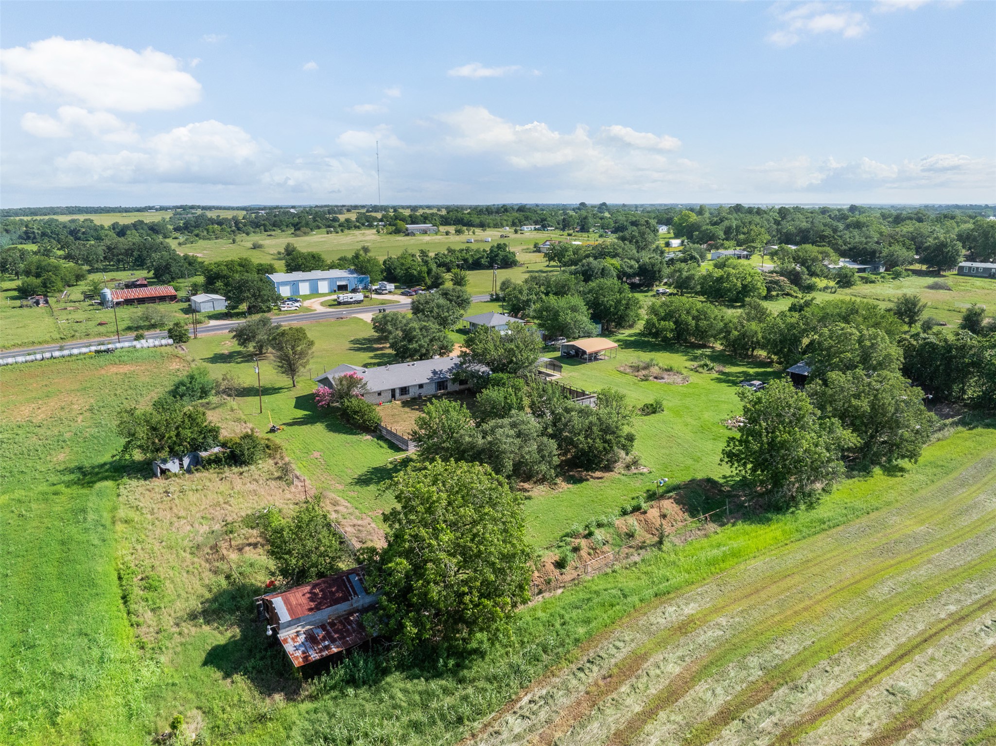 1015 FM 112 Road Lexington, TX 78947 - Photo 33 of 38 an aerial view of residential house with outdoor space and trees all around