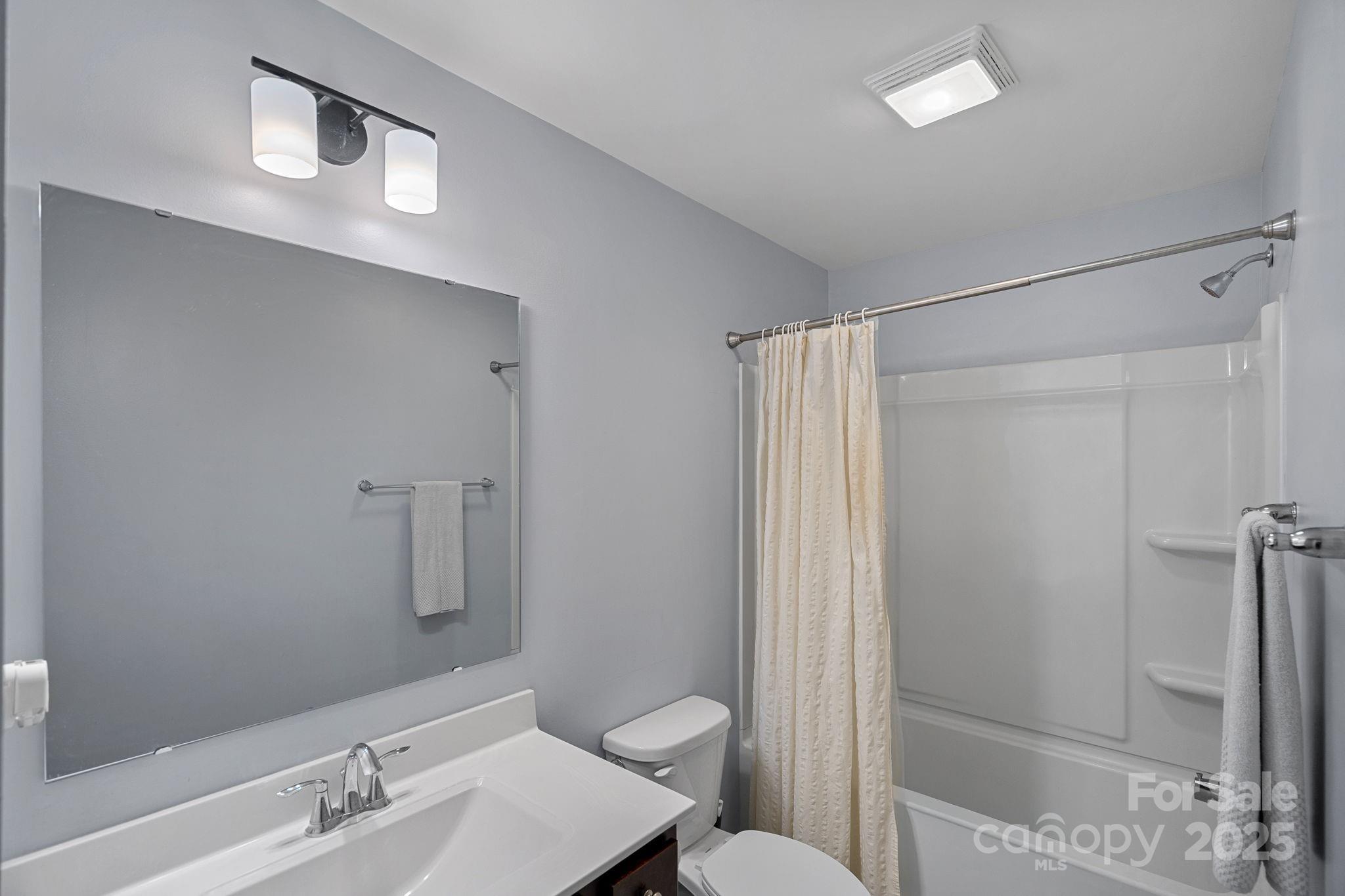 4780 Selhurst Drive Fort Mill, SC 29707 - Photo 23 of 34 a bathroom with a granite countertop sink toilet and shower