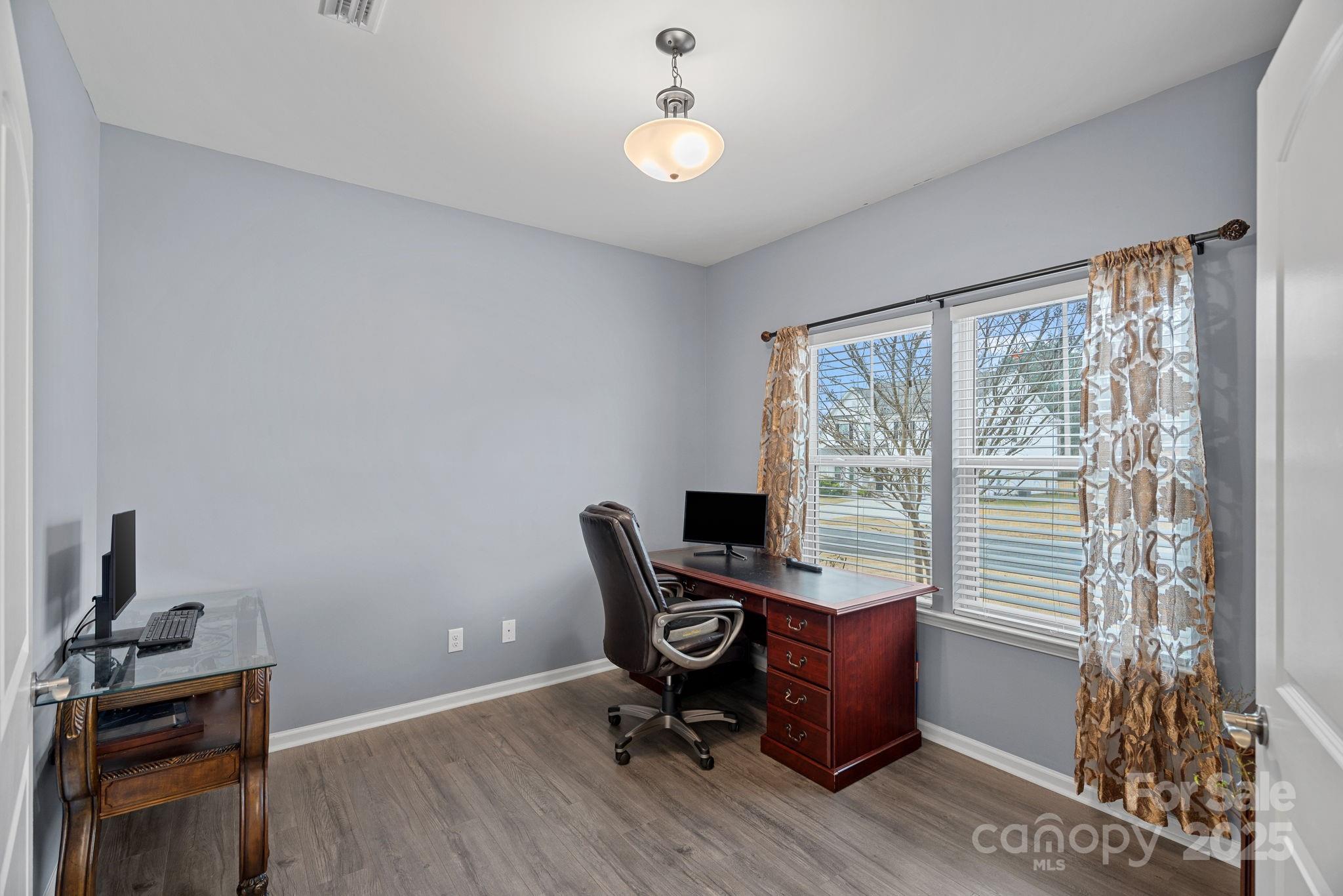 4780 Selhurst Drive Fort Mill, SC 29707 - Photo 4 of 34 a view of a workspace with furniture and a window