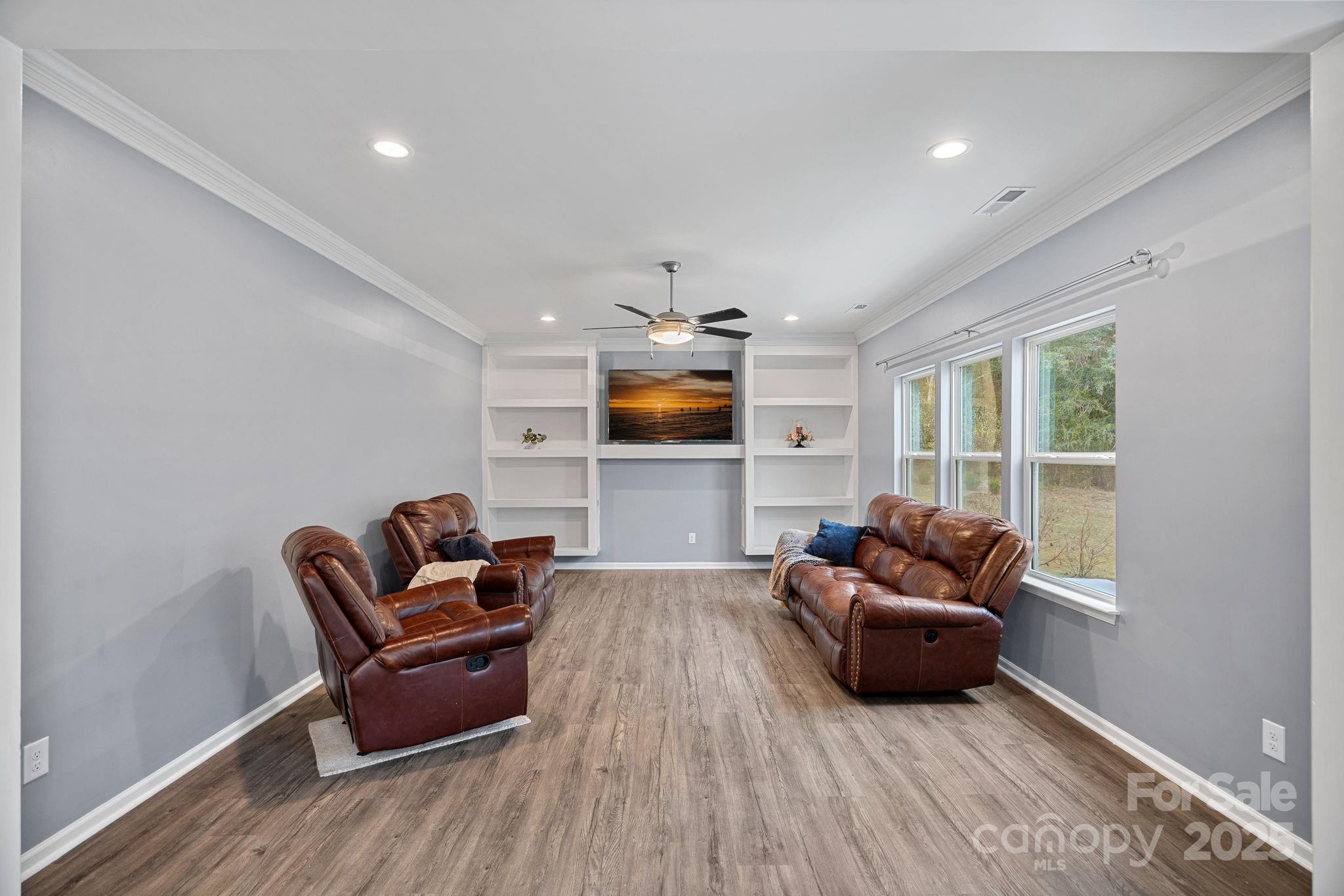 4780 Selhurst Drive Fort Mill, SC 29707 - Photo 9 of 34 a living room with furniture and a flat screen tv