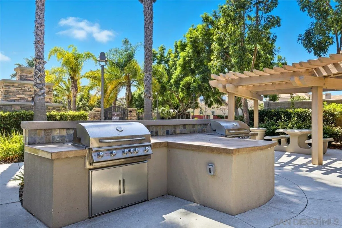4249 Peralta Street Carlsbad, CA 92010 - Photo 43 of 49 a view of a kitchen with a stove and a potted plant