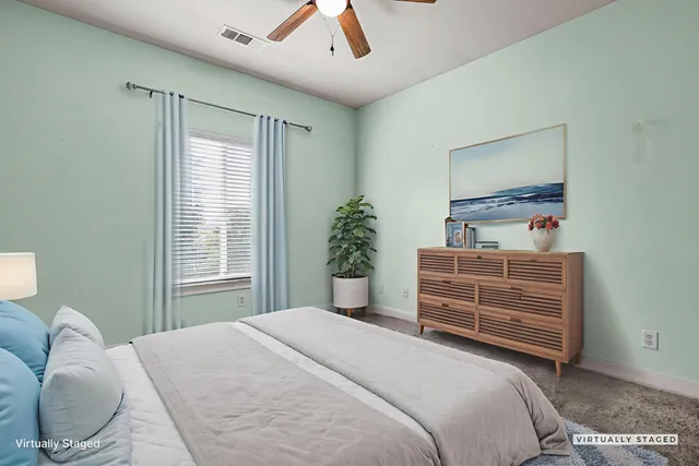 a bedroom with a bed and a dresser