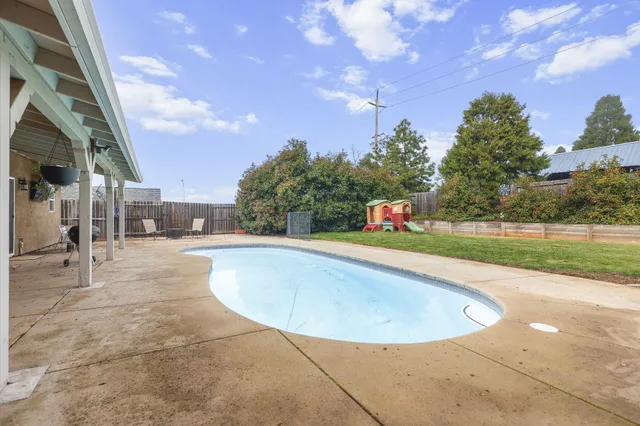 a view of outdoor space yard swimming pool and green space