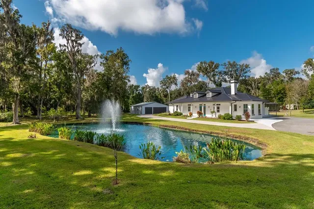 a front view of a house with a swimming pool