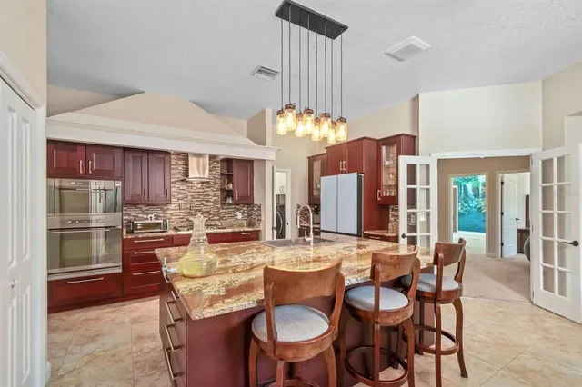 a view of a dining room with furniture window and outside view