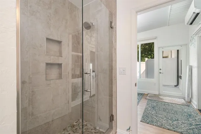 a view of a room with furniture and a window