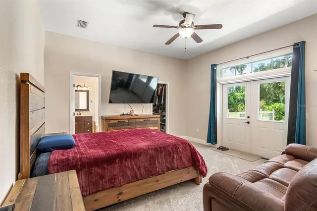 a bedroom with furniture and a fireplace
