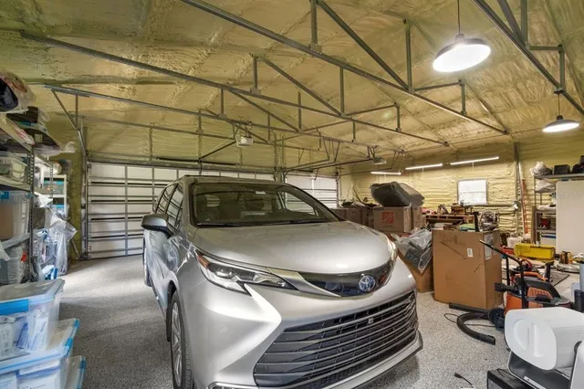 a view of a swimming pool with an outdoor seating and a yard