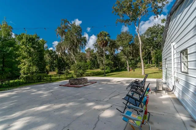 a view of a swimming pool with a yard