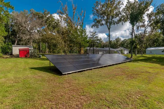 a view of a house with a wooden fence