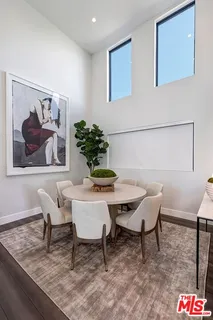 a living room with furniture or wooden floor and a table