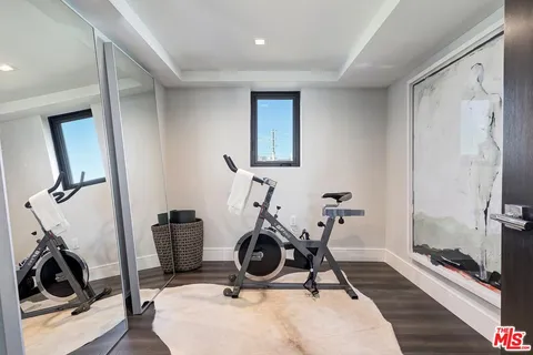a spacious bedroom with a bed and a couch
