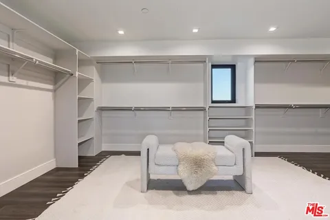 a bathroom with a granite countertop sink mirror and bathtub