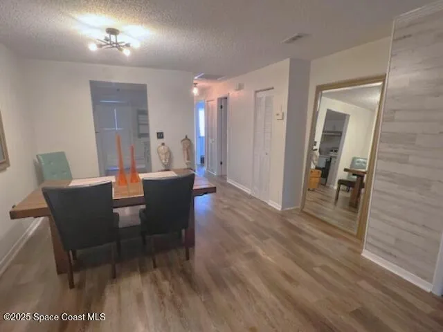 a bedroom with a bed and a dresser in it