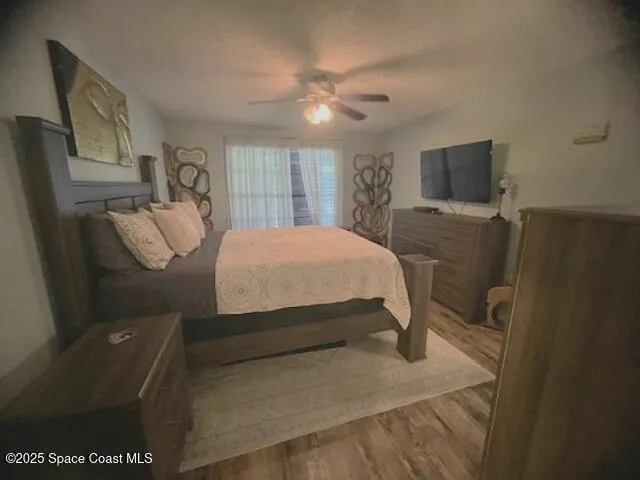 a bathroom with a shower curtain and a window
