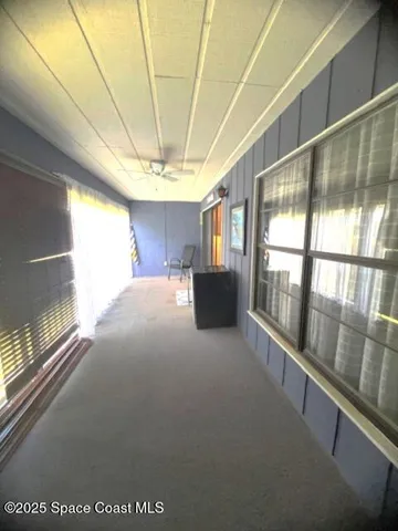 a view of a hallway with a window