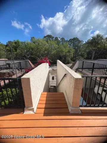 a view of a patio with a table and chairs