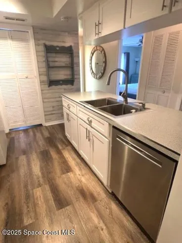 a living room with couches and painting on the wall