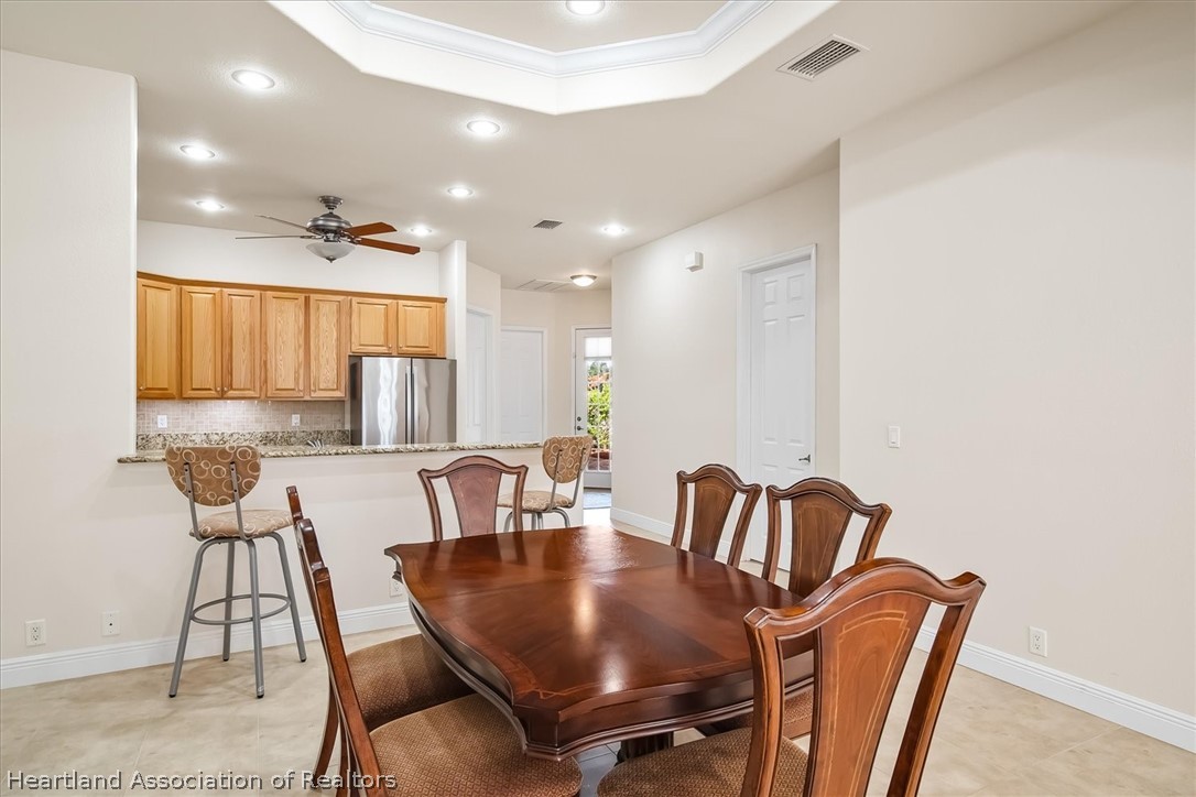 5224 Haw Branch Road Sebring, FL 33875 - Photo 9 of 40 a view of a dining room with furniture