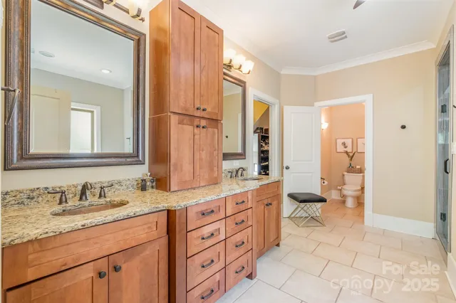 a spacious bathroom with a granite countertop sink mirror and a