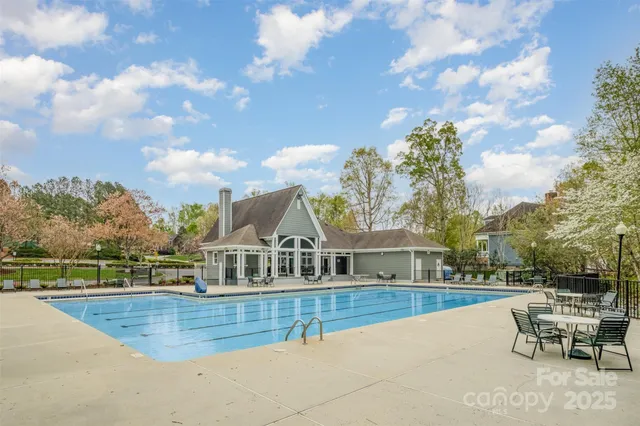 a view of a swimming pool with a lounge chairs