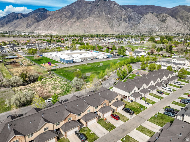 1179 West 100 South Springville, UT 84663 - Photo 29 of 32 Aerial perspective showcasing a residential community with prominent mountain backdrop