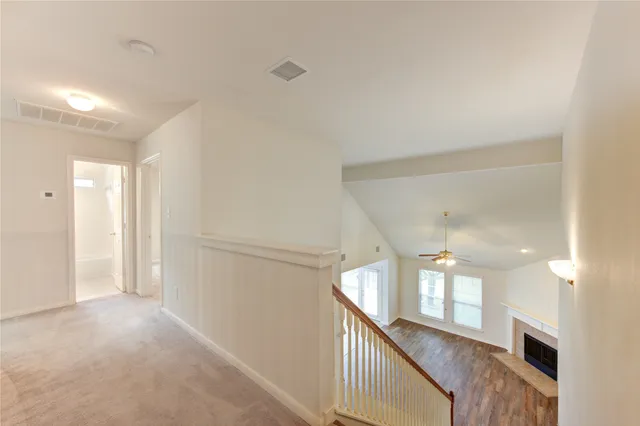 a view of a hallway with an entryway