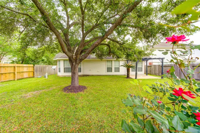 a house with a tree in front of a house