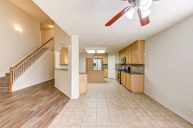 a view interior of a house kitchen stove and wooden floor