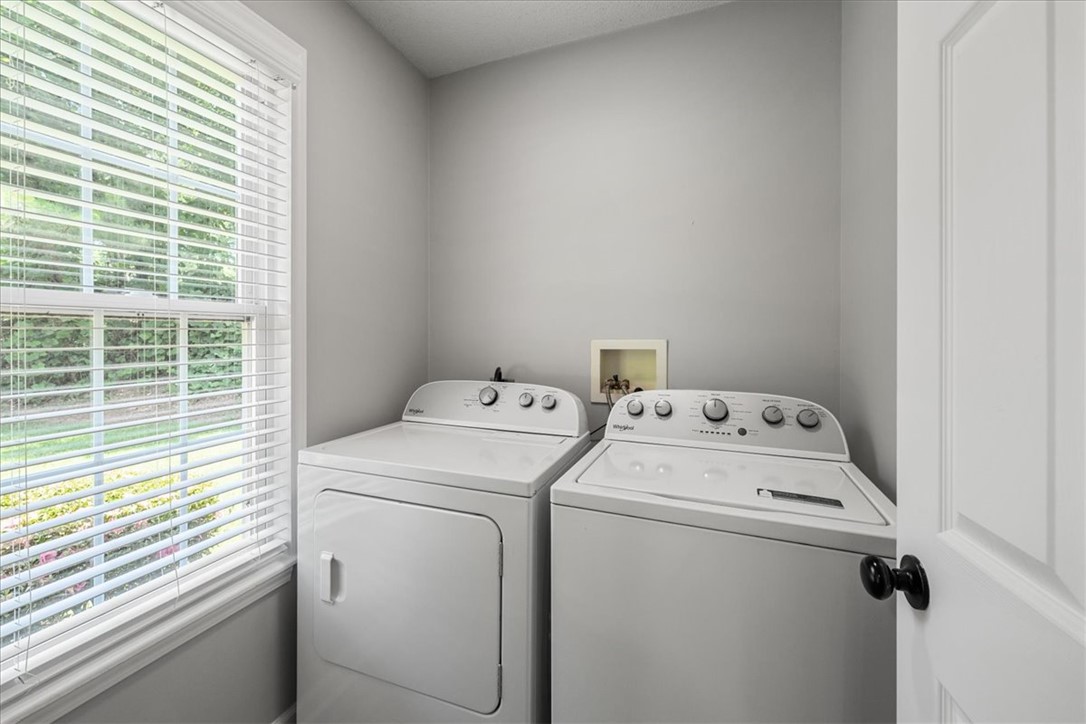 212 Blue Ridge Drive Clemson, SC 29631 - Photo 13 of 33 Functional laundry space featuring a window and modern appliances, simplifying household tasks.