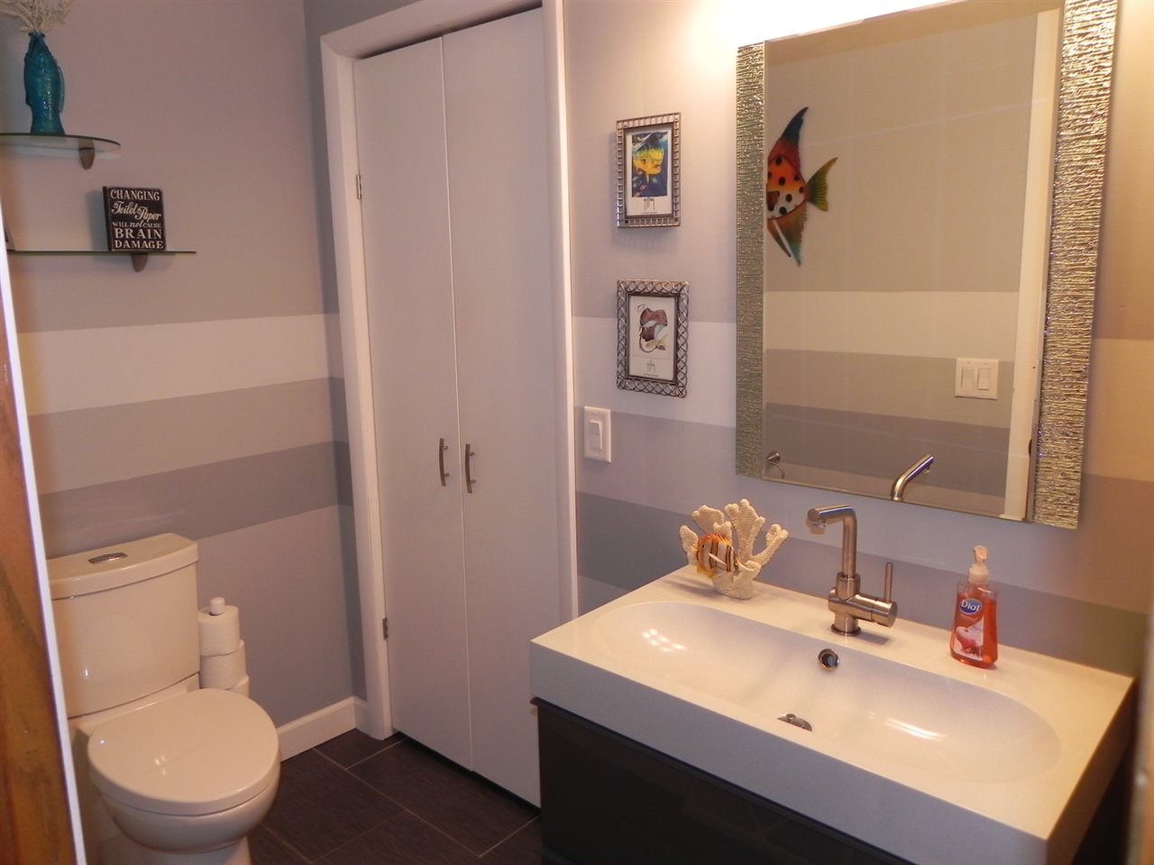 232 Lake Summerset Road Lake Summerset, IL 61019 - Photo 11 of 24 a bathroom with a sink mirror and toilet