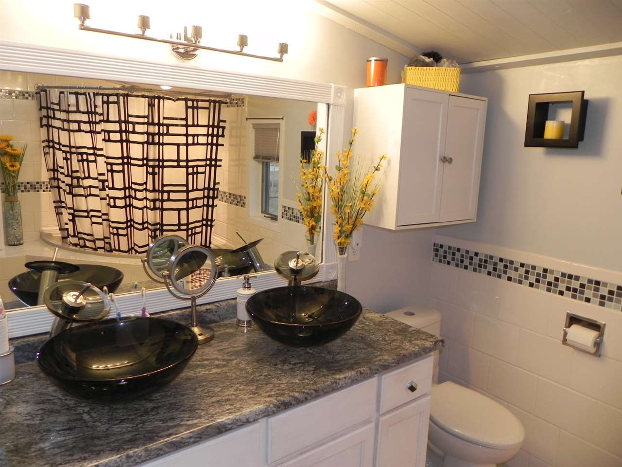 232 Lake Summerset Road Lake Summerset, IL 61019 - Photo 22 of 24 a bathroom with a sink a toilet and a mirror