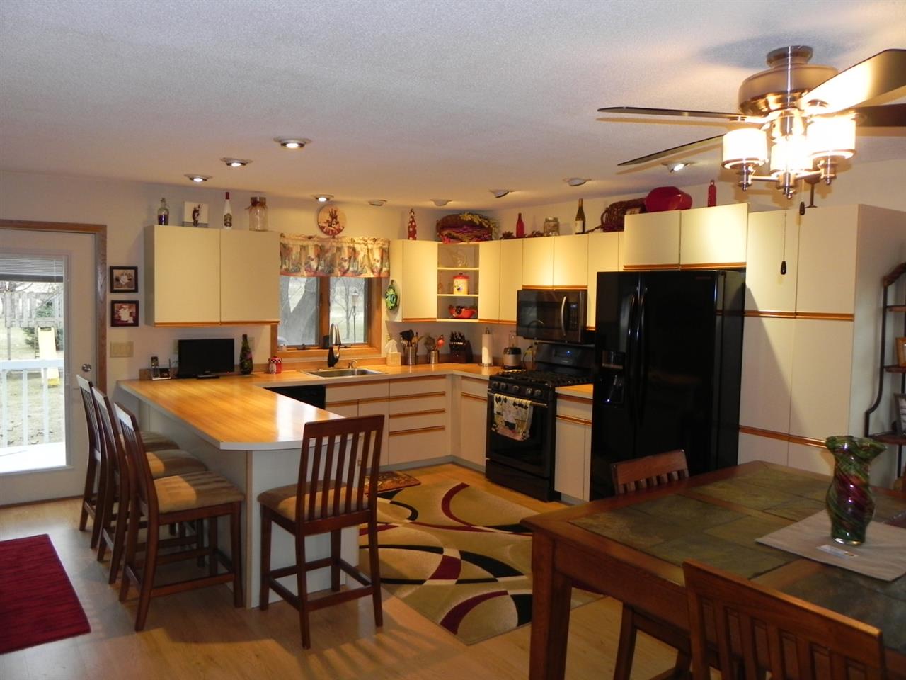 232 Lake Summerset Road Lake Summerset, IL 61019 - Photo 4 of 24 a kitchen with a table and chairs in it