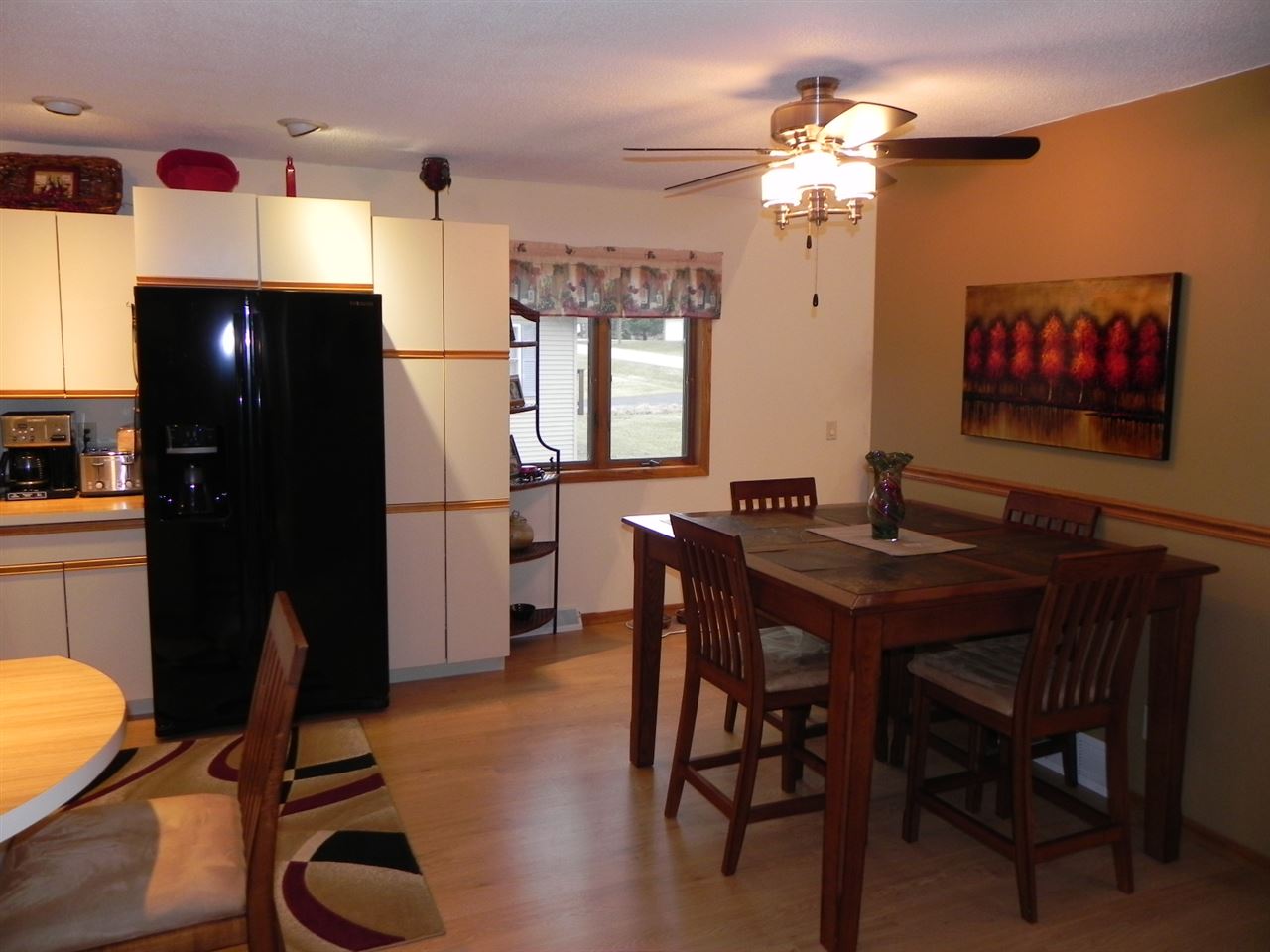 232 Lake Summerset Road Lake Summerset, IL 61019 - Photo 6 of 24 a view of a dining room with furniture and a chandelier