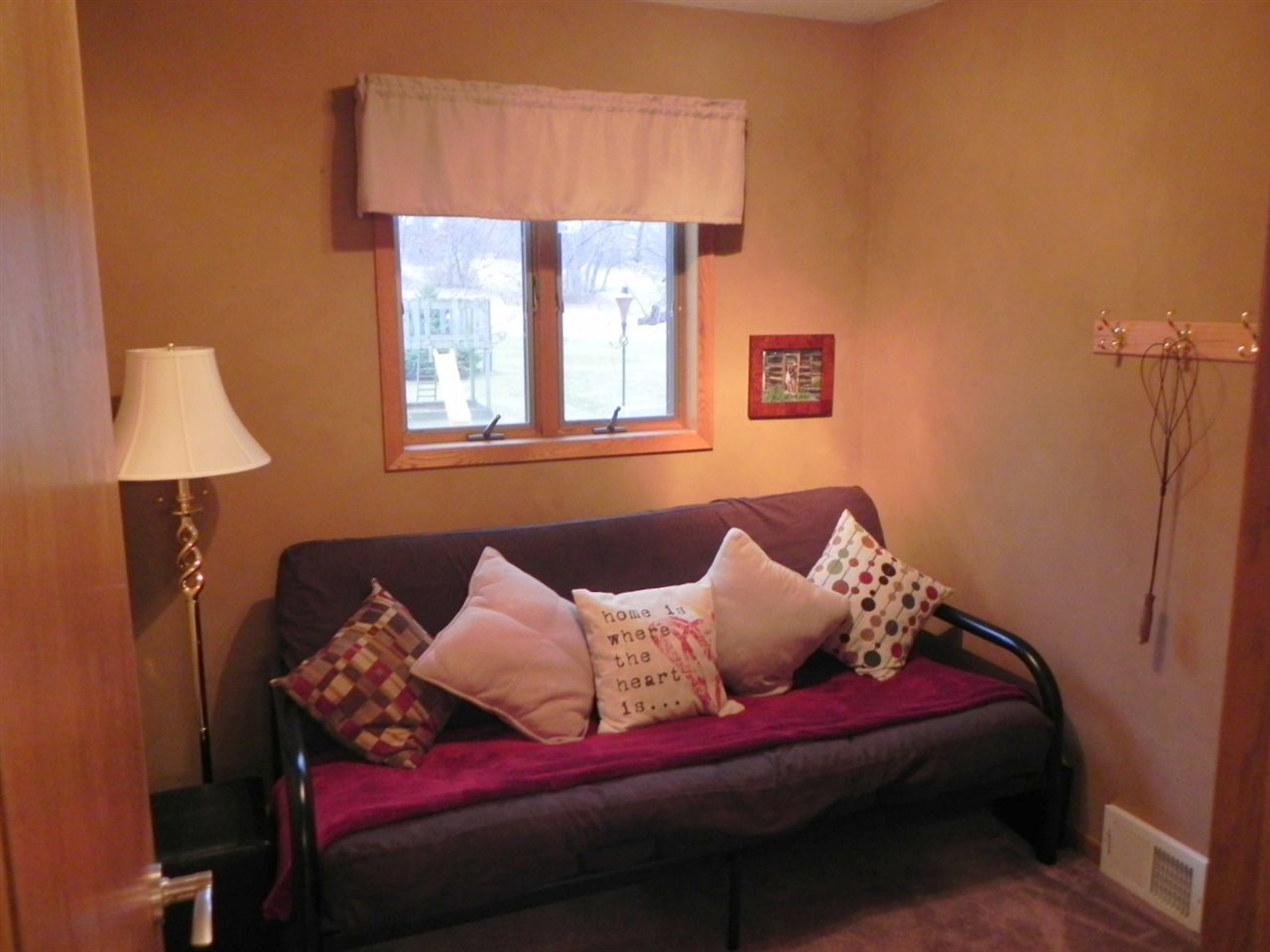 232 Lake Summerset Road Lake Summerset, IL 61019 - Photo 9 of 24 a bed sitting in a bedroom next to a window
