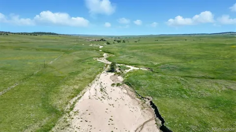 a view of a lake with a yard