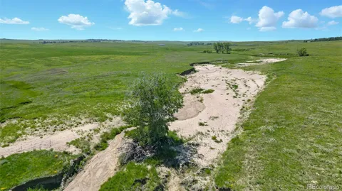 a view of a lake with a building in the background