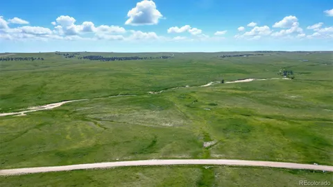 a view of a golf course with a lake