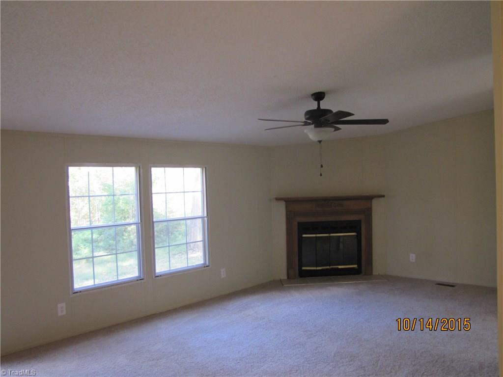 1085 Fagg Farm Road Walnut Cove, NC 27052 - Photo 4 of 24 Large Living Room with corner fireplace.