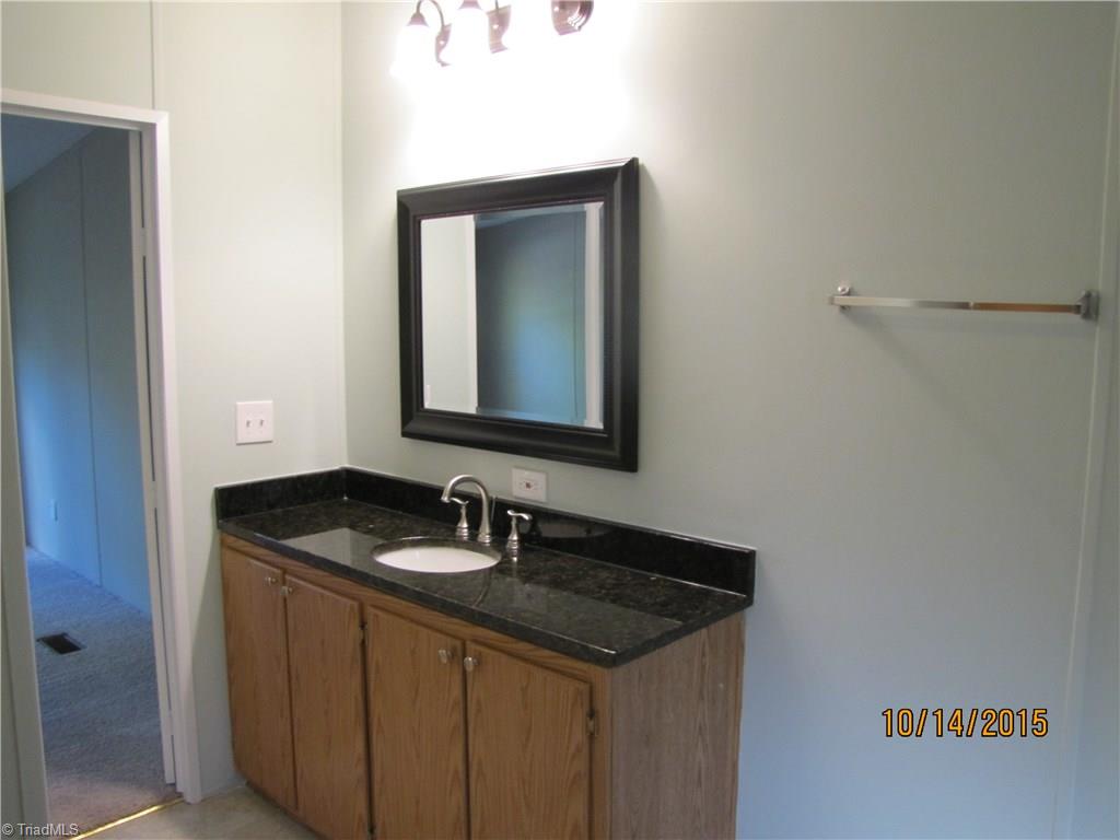 1085 Fagg Farm Road Walnut Cove, NC 27052 - Photo 8 of 24 Master Bathroom has new granite top on vanity.