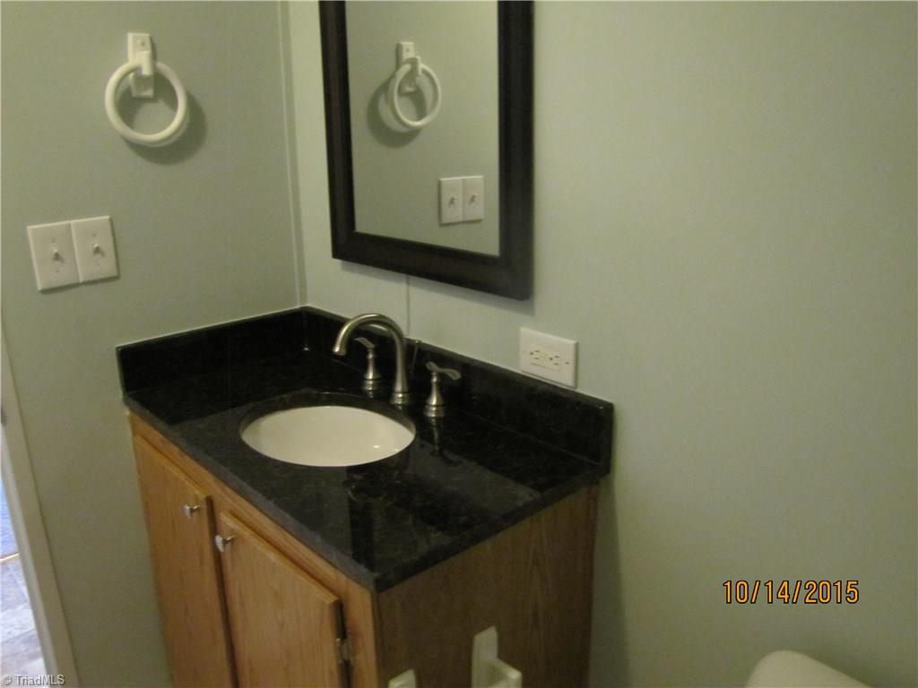 1085 Fagg Farm Road Walnut Cove, NC 27052 - Photo 9 of 24 Hall Bath has new granite top on vanity.